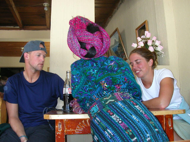 Spanish students from Guatemalensis Spanish School talking in spanish with a native woman at Panajachel shore