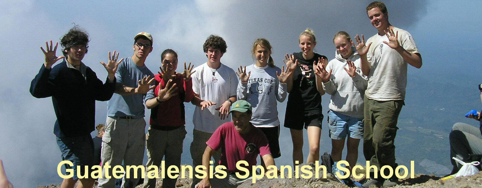 Group of youths on the summit of the Santa Maria volcano.