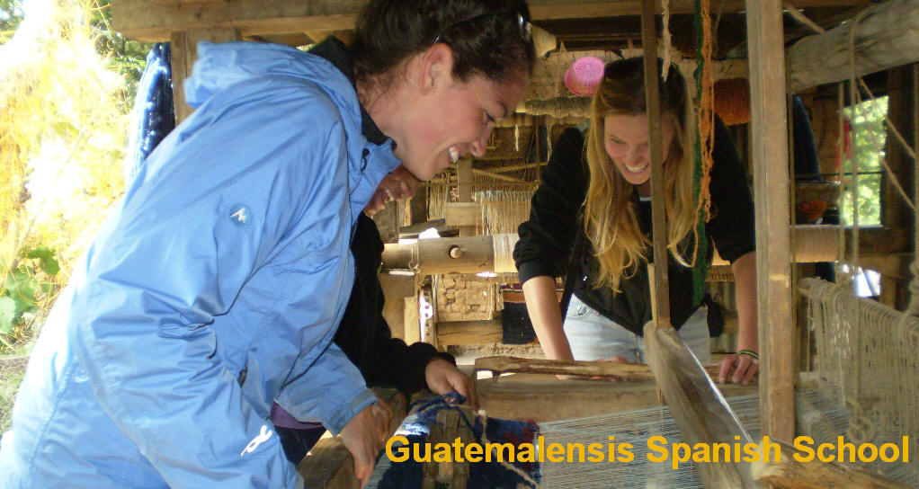 Spanish language students at Guatemalensis Spanish School learning how to weave by an ancestral method in one of our activities.